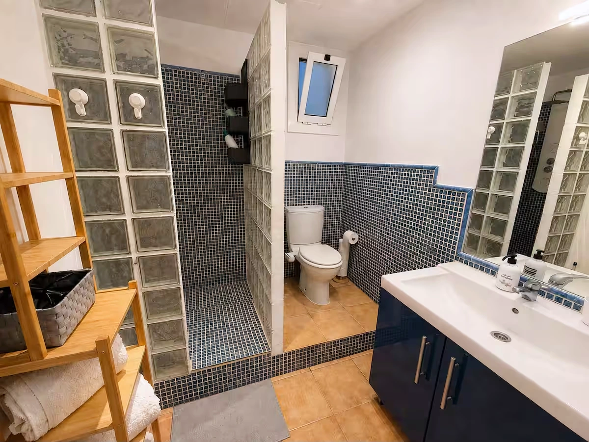 Full bathroom with shower and vanity